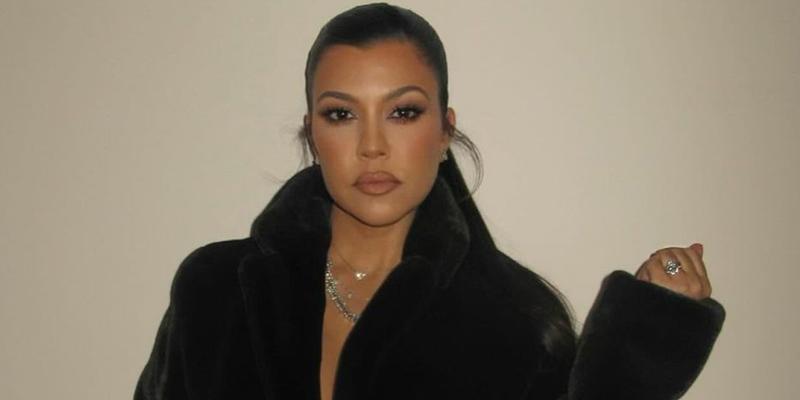 Kourtney Kardashian photographed wearing a black robe after the birth of son Rocky.