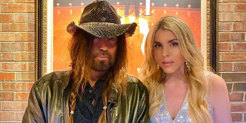 Firerose and Billy Ray Cyrus pose together backstage at the Grand Ole Opry