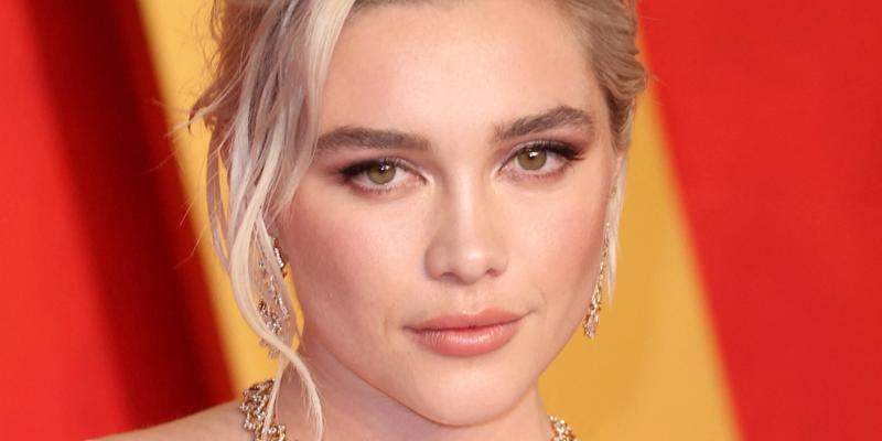 Florence Pugh poses at an event