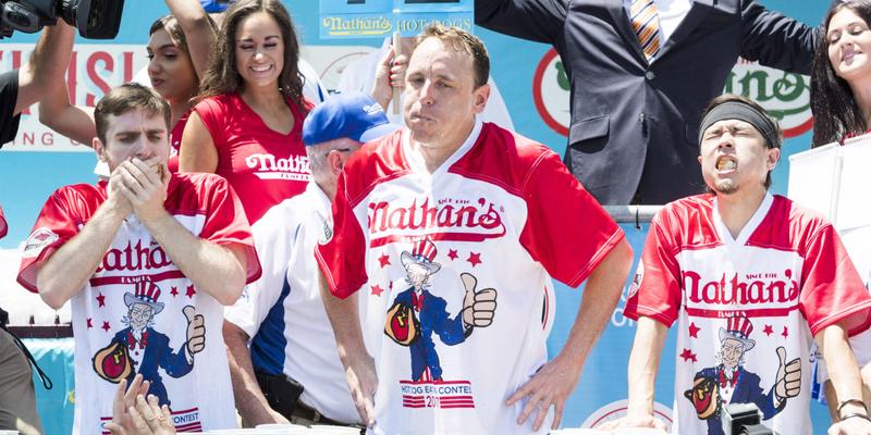 Joey Chestnut and others compete in Nathans Famous International Hot Dog Eating Contest