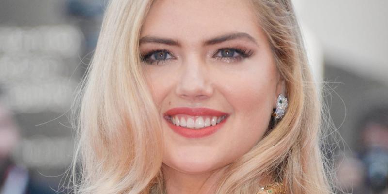 Kate Upton smiles at an event