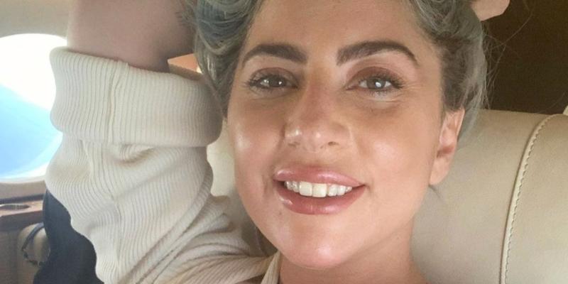 Lady Gaga smiles from a plane