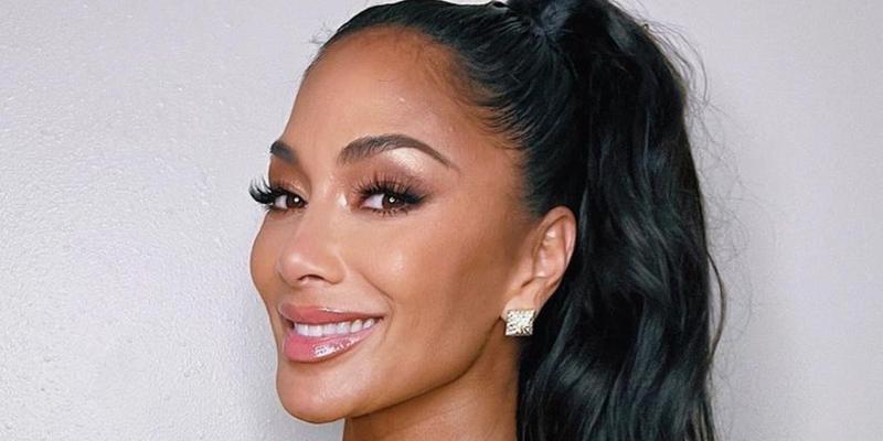 Nicole Scherzinger smiles at the camera.