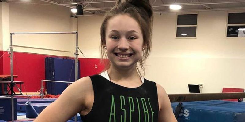 Kara Welsh smiling in the gym