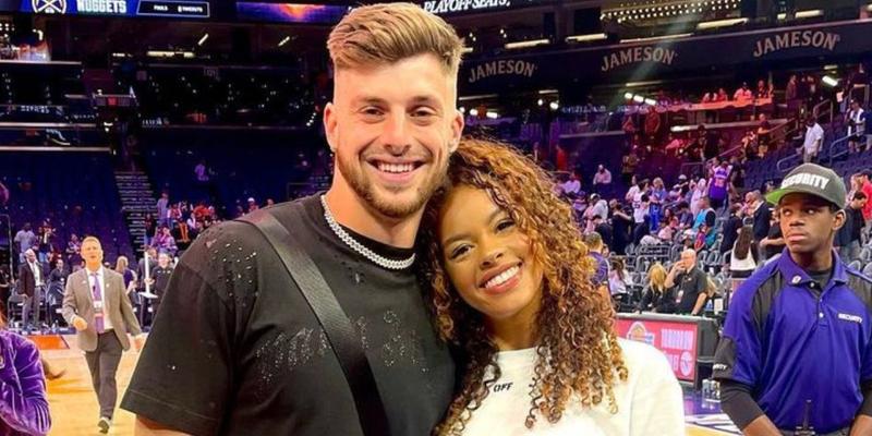 Ricky Pearsall and a woman at a basketball game