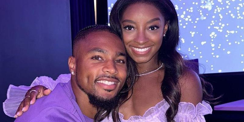 Jonathan Owens and Simone Biles matching in purple outfits