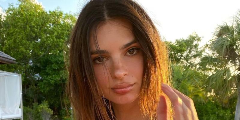 Emily Ratajkowski poses for the camera.