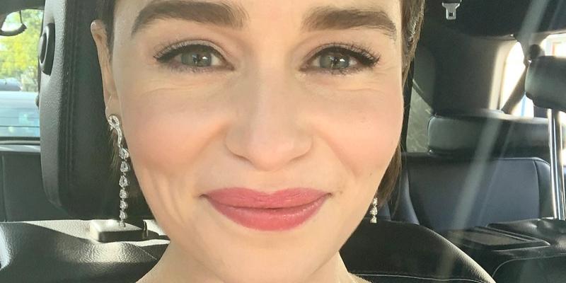 Emilia Clarke poses smiling