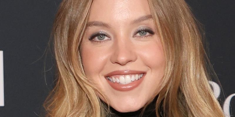 Sydney Sweeney smiling close up