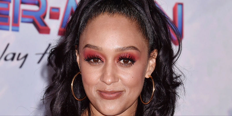 Tia Mowry at Spiderman premiere banner