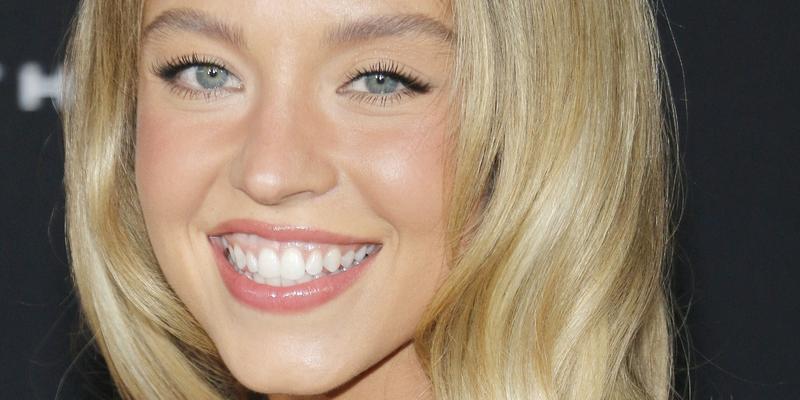 Sydney Sweeney smiling close up