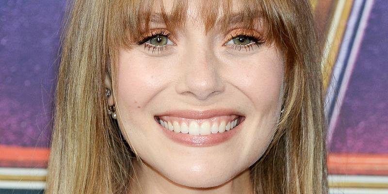 Elizabeth Olsen smiles at an event