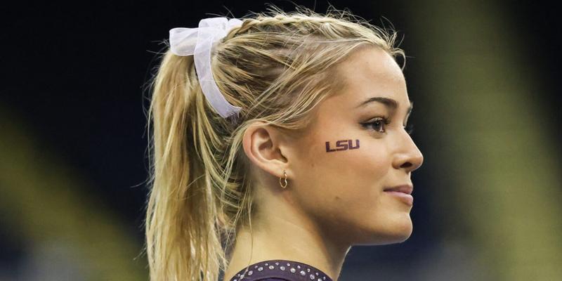 March 8, 2024: LSU's Olivia Dunne watches as her teammates warm up on the floor during the Purple and Gold Podium Challenge woman's gymnastics quad meet at the Raising Canes River Center in Baton Rouge, LA. Jonathan Mailhes/CSM (Credit Image: © Jonathan Mailhes/Cal Sport Media) Newscom/(Mega Agency TagID: csmphotothree239119.jpg) [Photo via Mega Agency]