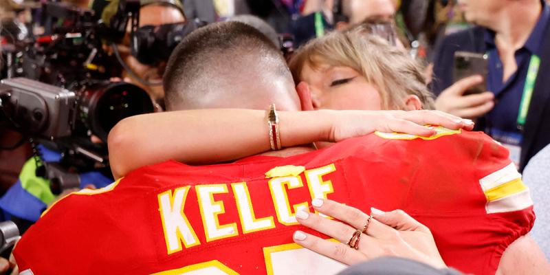 Taylor Swift embraces beau Travis Kelce after the Kansas City Chiefs win the super bowl