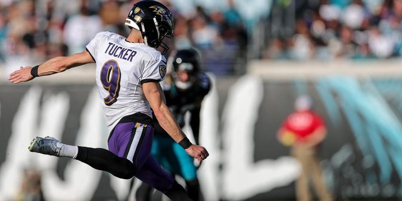 Justin Tucker kicking a football