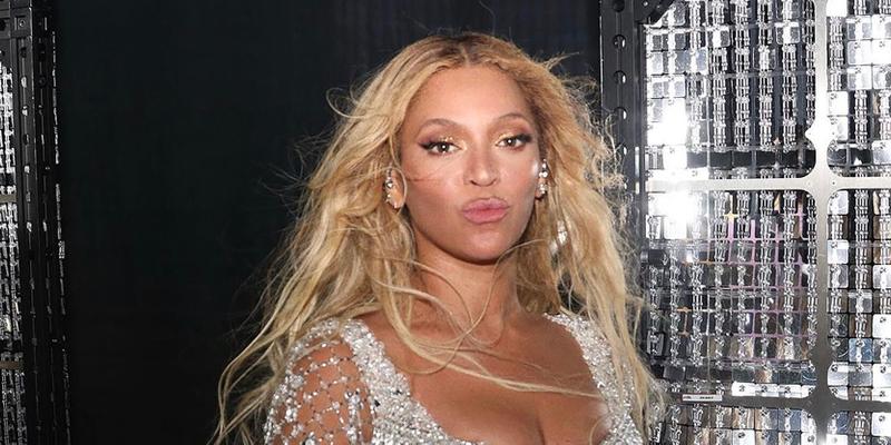 Beyoncé posing in silver behind the scenes of the RENAISSANCE World Tour.