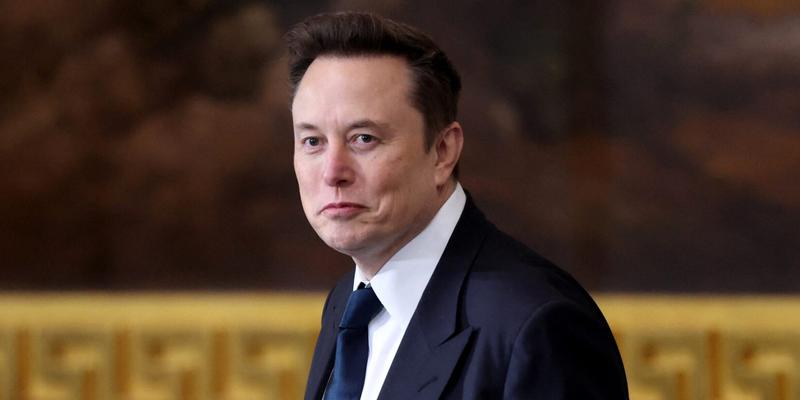 Elon Musk in a suit