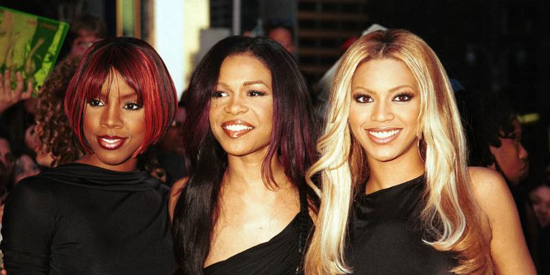 Destiny's Child posing in all black for a group photo in 2001.