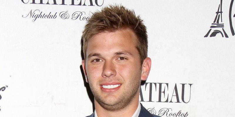 Chase Chrisley posing on the red carpet.