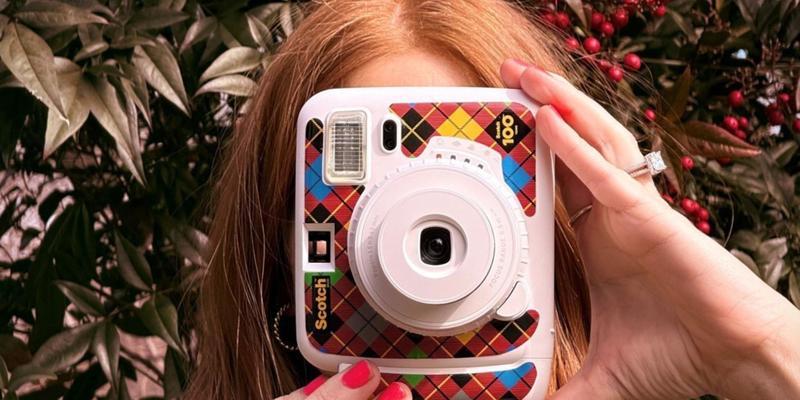 Jenn Todryk snaps a picture with a limited-edition Scotch Brand instant print camera