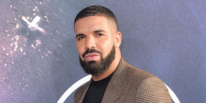 Drake posing on the red carpet.