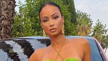 Draya Michele Shows Her Money-Maker While Unbuttoned In Thigh-Highs