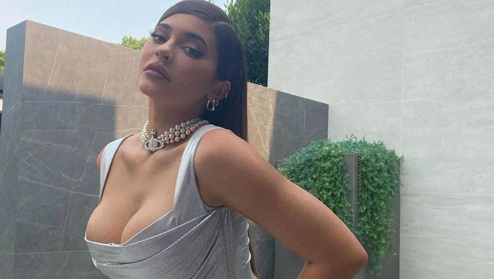 Kylie Jenner Leans Over In Slit Dress Without Visible Underwear