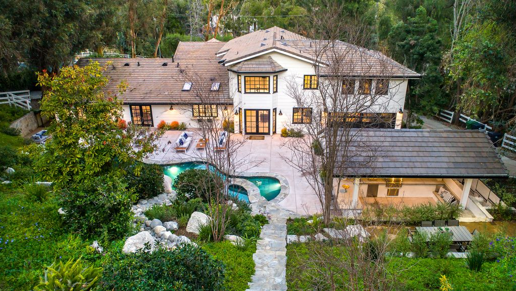 Miley Cyrus Buys House In The Kardashian’s Neighborhood With It’s Own Movie Theater!!